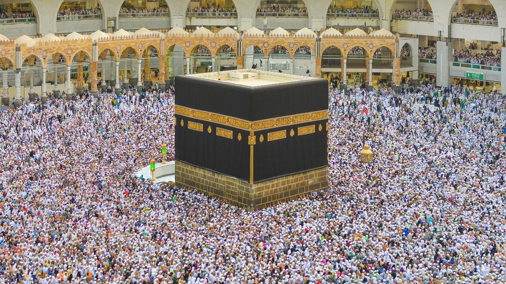 The Kaaba in Masjid al-Haram, Makkah, Saudi Arabia, surrounded by pilgrims during Hajj.