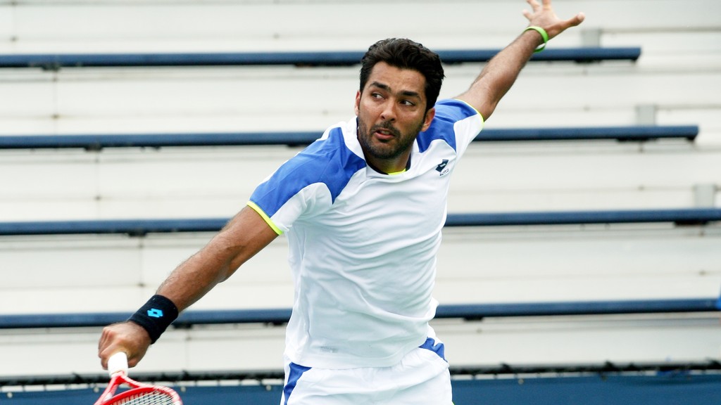 Pakistan Tennis Federation president Aisam-ul-Haq Qureshi playing a shot during a tennis match