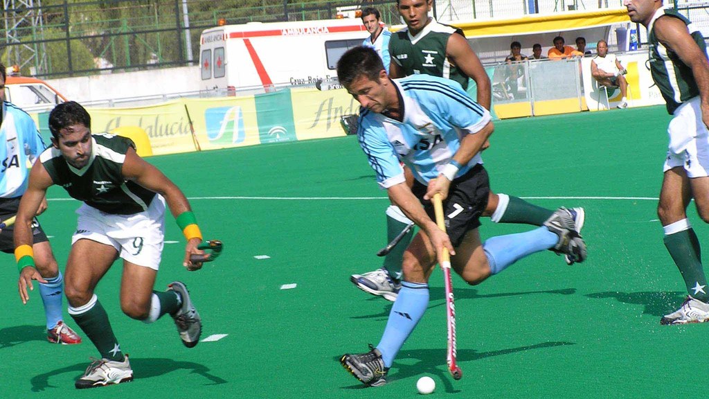 Pakistan hockey players in action against Argentina in a field hockey match