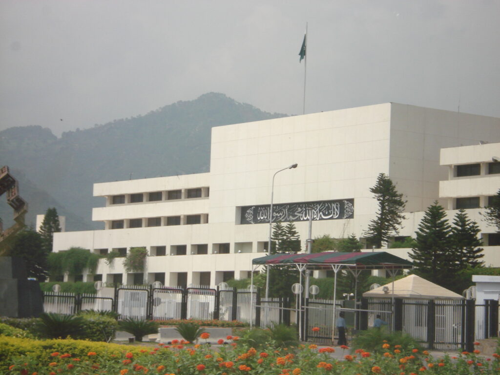 Parliament House in Islamabad, the seat of the National Assembly and Senate, with the Margalla Hills in the background