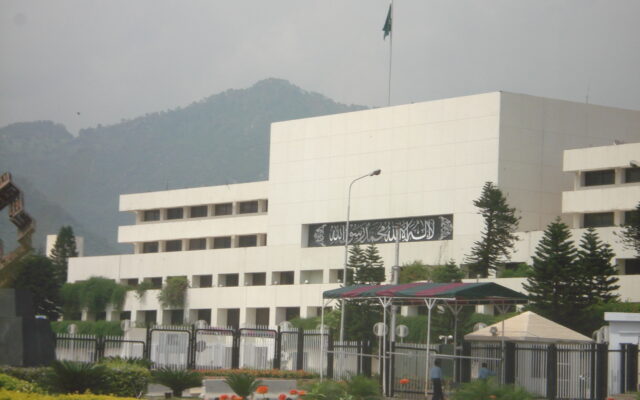 Parliament House in Islamabad, the seat of the National Assembly and Senate, with the Margalla Hills in the background