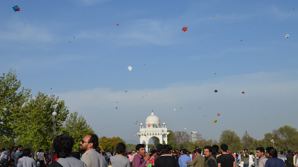 Colourful kites fill the sky over a Basant festival crowd in Pakistan