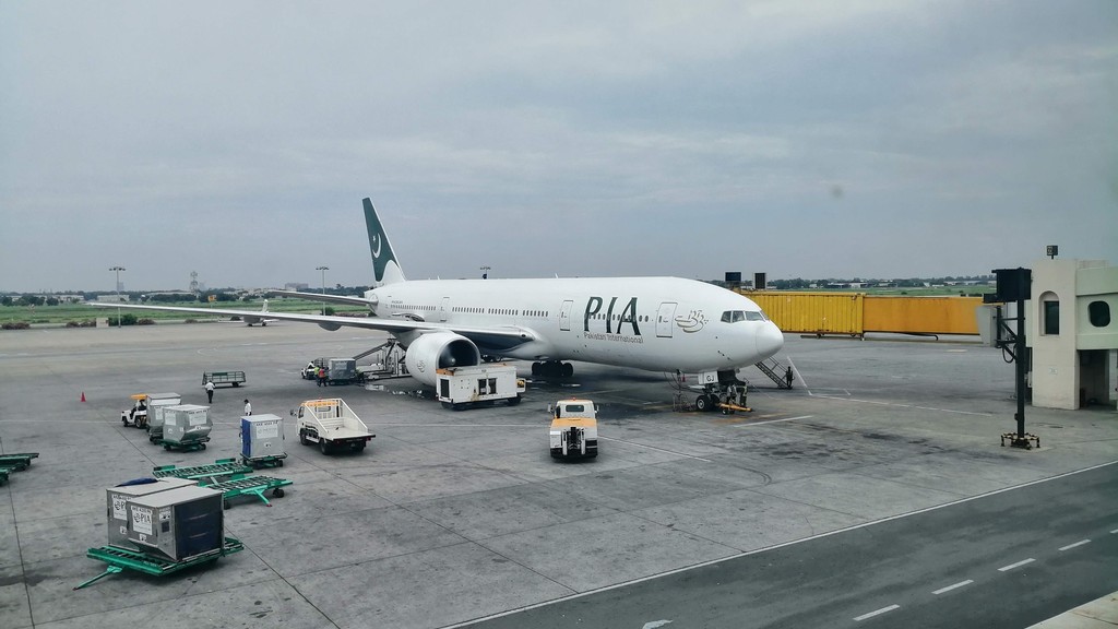 A Pakistan International Airlines Boeing 777 in PIA livery parked at Allama Iqbal International Airport, Lahore