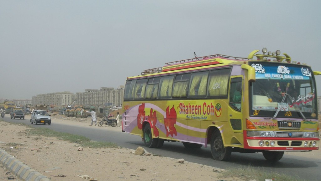 A passenger coach travelling on a national highway near Karachi, Pakistan
