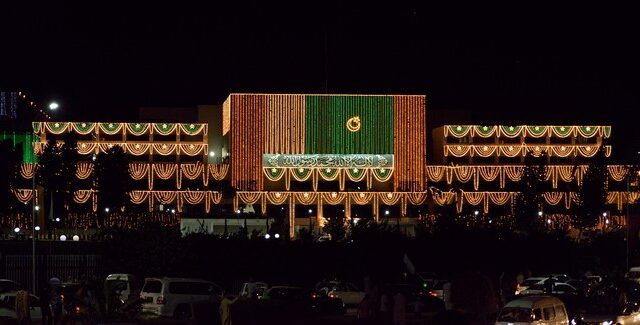 Parliament House in Islamabad illuminated at night, the seat of Pakistan's National Assembly and Senate