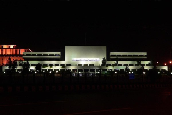 Parliament House in Islamabad illuminated at night, where the National Assembly approved the emergency proclamation for Khyber Pakhtunkhwa