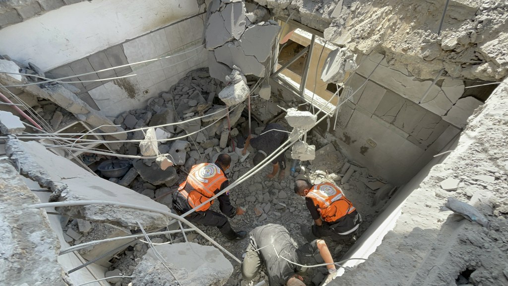 Civil defence workers in Gaza searching for victims under the rubble of destroyed buildings, as bodies continue to be recovered a year into the ceasefire