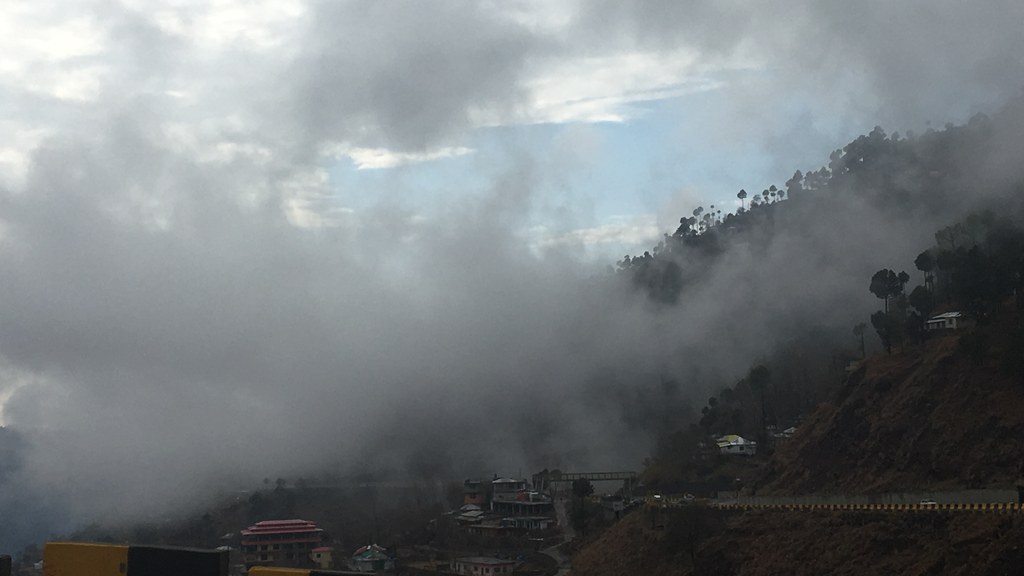 A hillside road in Murree, Pakistan, with houses on the slope — file photo.