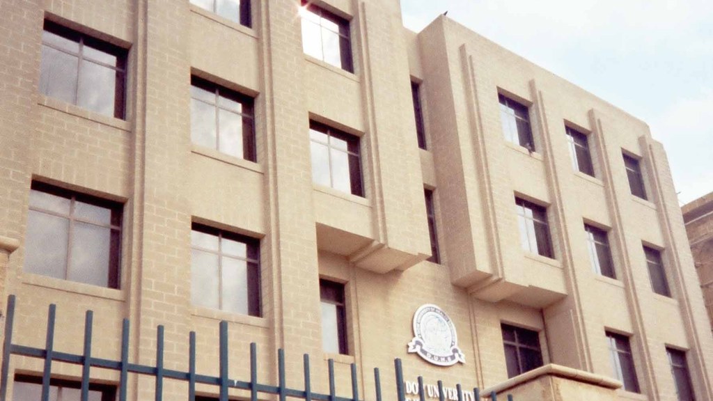 Dow University of Health Sciences building in Karachi, with the university crest and name above the entrance