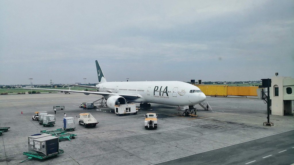 A Pakistan International Airlines Boeing 777 at Allama Iqbal International Airport in Lahore, where an audit found a premium seat booking fraud involving more than 20 staff members