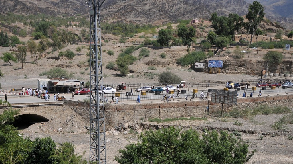 Vehicles and travellers at the Torkham border crossing between Pakistan and Afghanistan