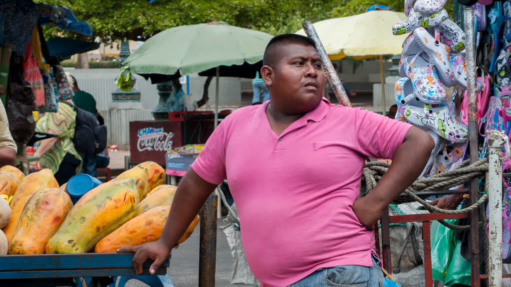 A fruit and vegetable seller at his stall, shown in a file photograph.