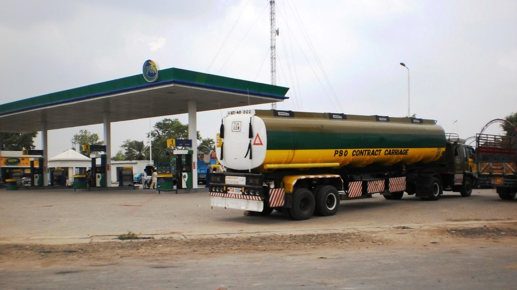 A PSO petrol station on GT Road in Pakistan with a fuel tanker parked under the canopy