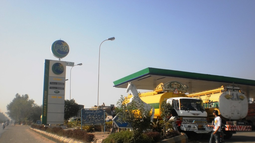 A PSO petrol station on GT Road in Pakistan with a fuel tanker parked under the canopy